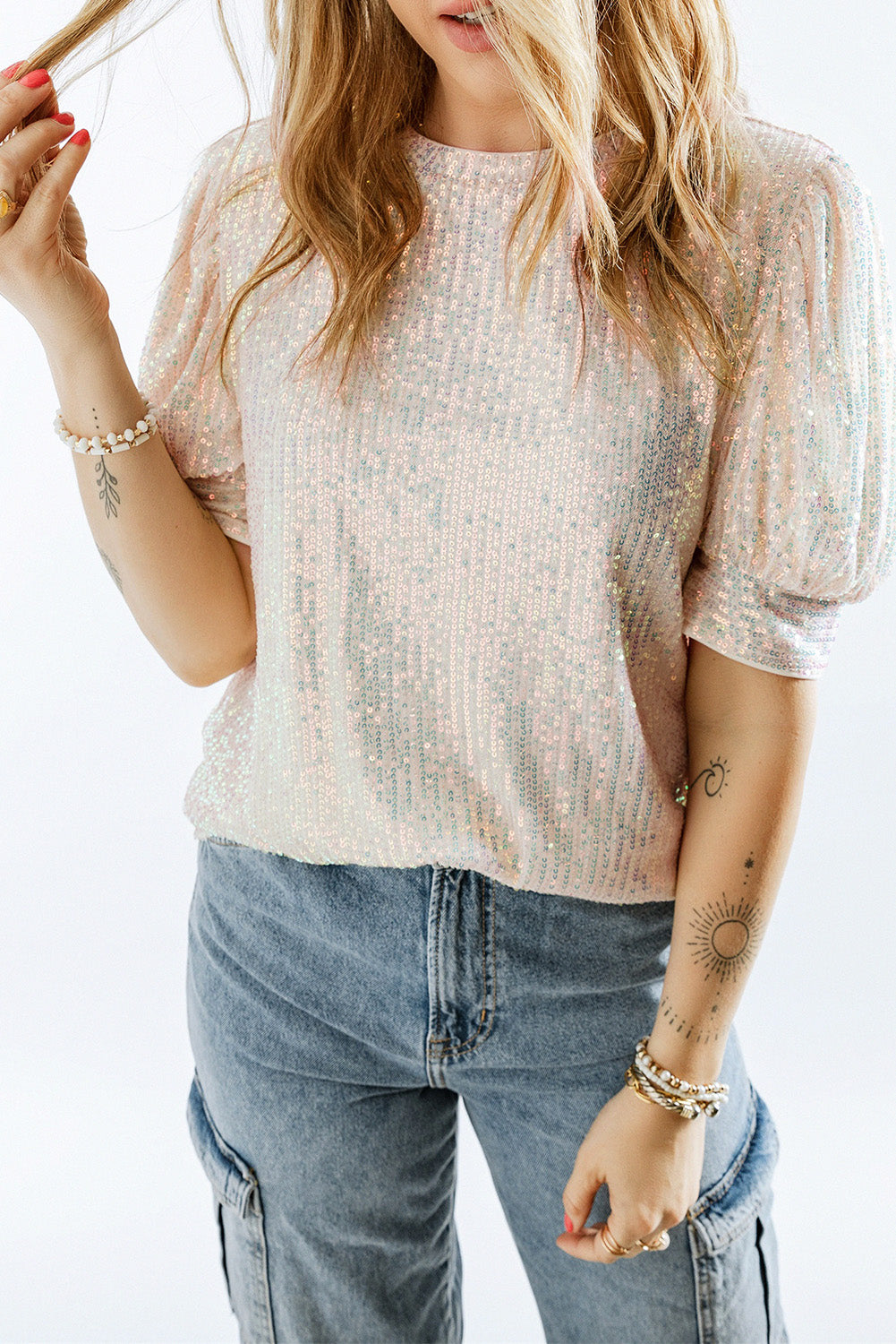 Add sparkle and style to your wardrobe with the Sequin Puff Sleeve Top! This top features glimmering sequin sleeves and a soft body fabric for a comfortable and fashionable ensemble when worn with your favourite jeans.