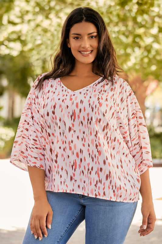 Brighten up your look with this eye-catching pink printed blouse, featuring flattering 3/4 dolman sleeves, perfect for any plus size outfit.