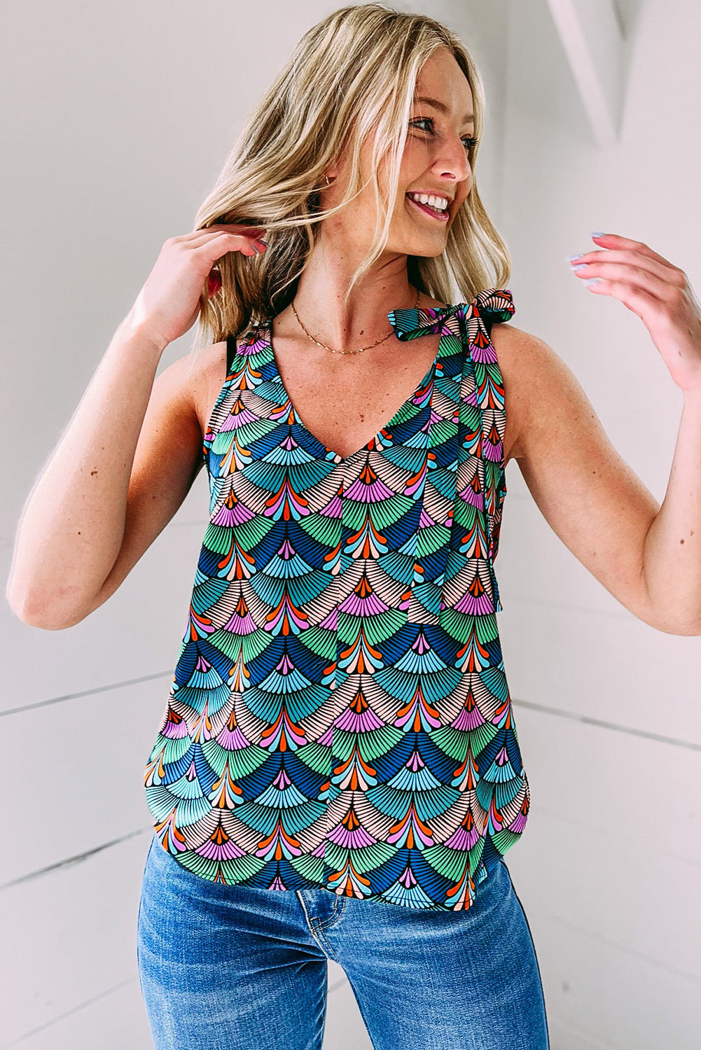 Blue Printed Knotted Shoulder Tank Top: A sleeveless V-neck tank with a stylish knot detail on the shoulder, featuring a versatile blue print