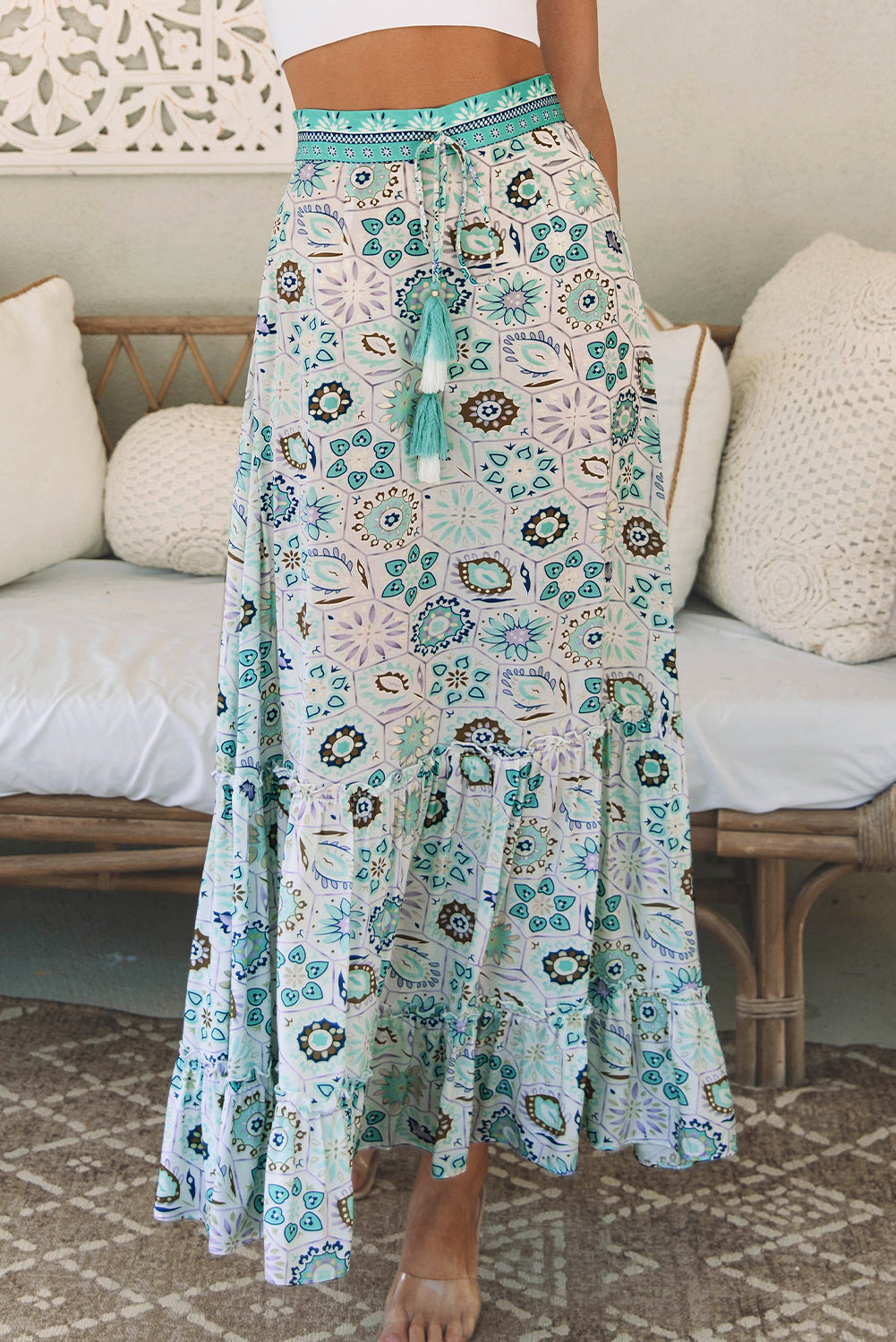 A beautiful sky blue maxi skirt with a feminine floral print and tiered ruffles. Perfect for dressy nights or casual days for an effortlessly stylish look.