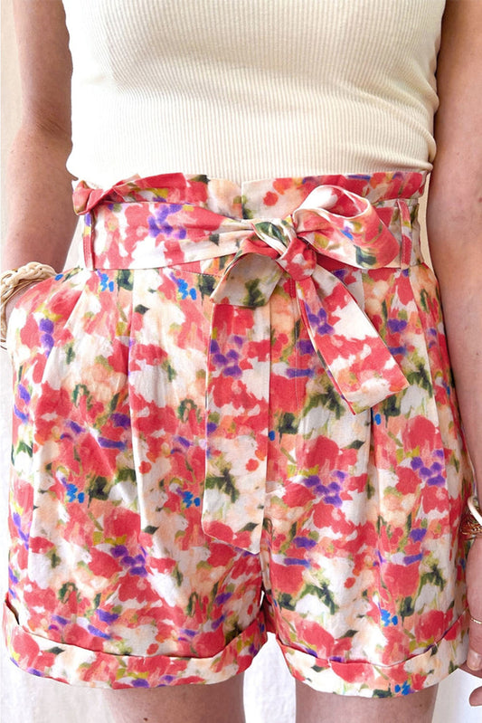 Stylish, vibrant floral print, adjustable lace-up detail, flattering high waist design, functional side pockets.