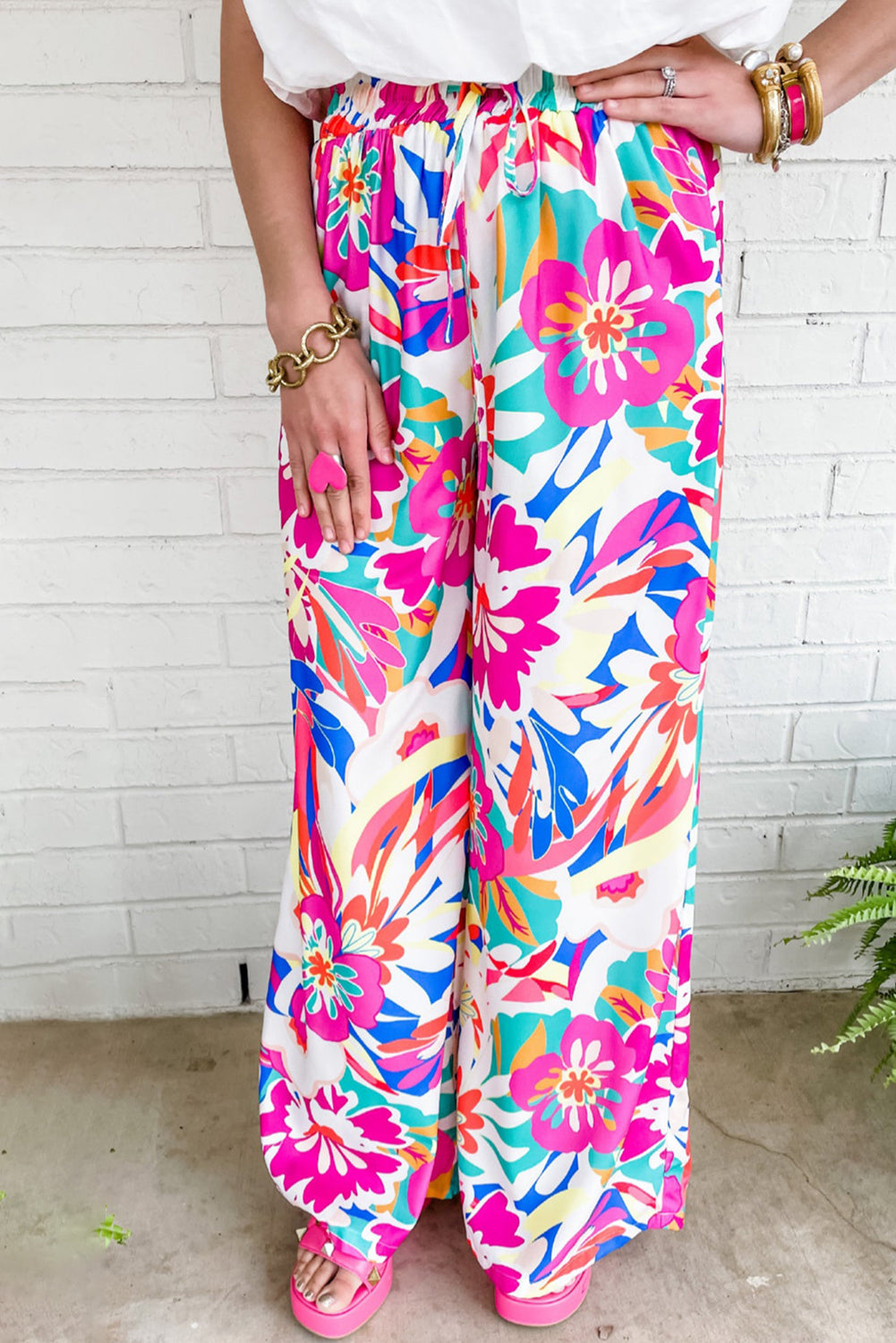 Boho-inspired, high waist wide-leg pants with sweet flower print.