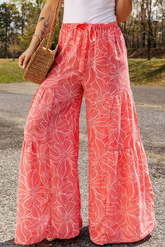 These light pink bohemian pants feature a beautiful floral print along with a wide-leg silhouette for a fun, breezy look!