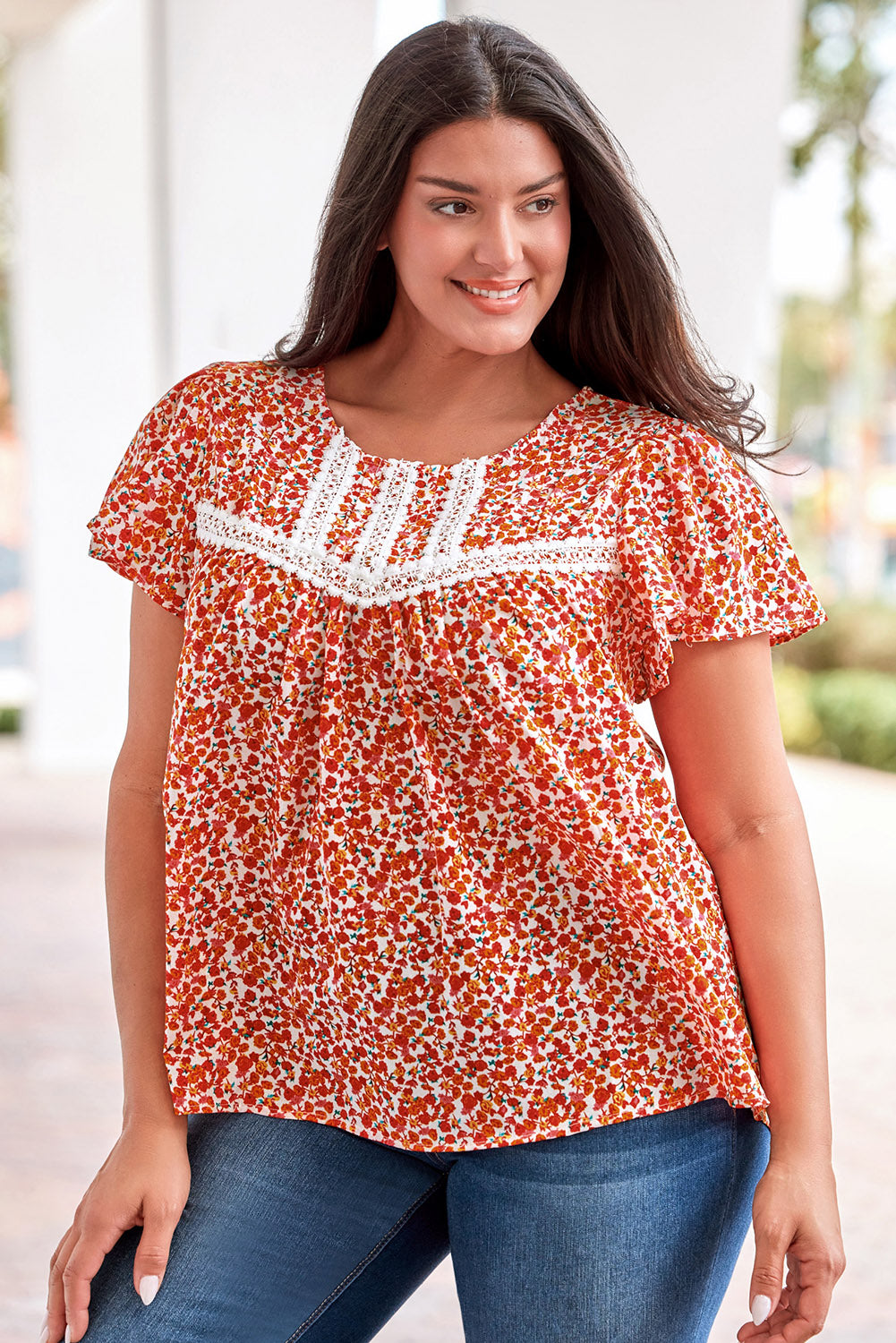 Make a bold statement with this fiery red floral printed blouse featuring lace trim and ruffle sleeves.