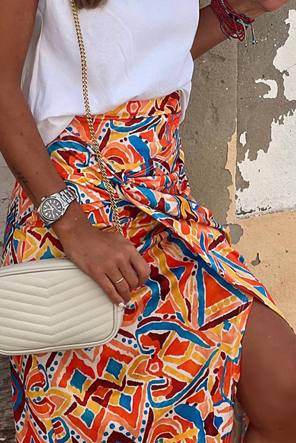A vivid, stylish yellow geometric abstract print maxi skirt with a high waist design and slit for easy movement, ideal for pairing with a blouse and sandals for a refined yet fun look.