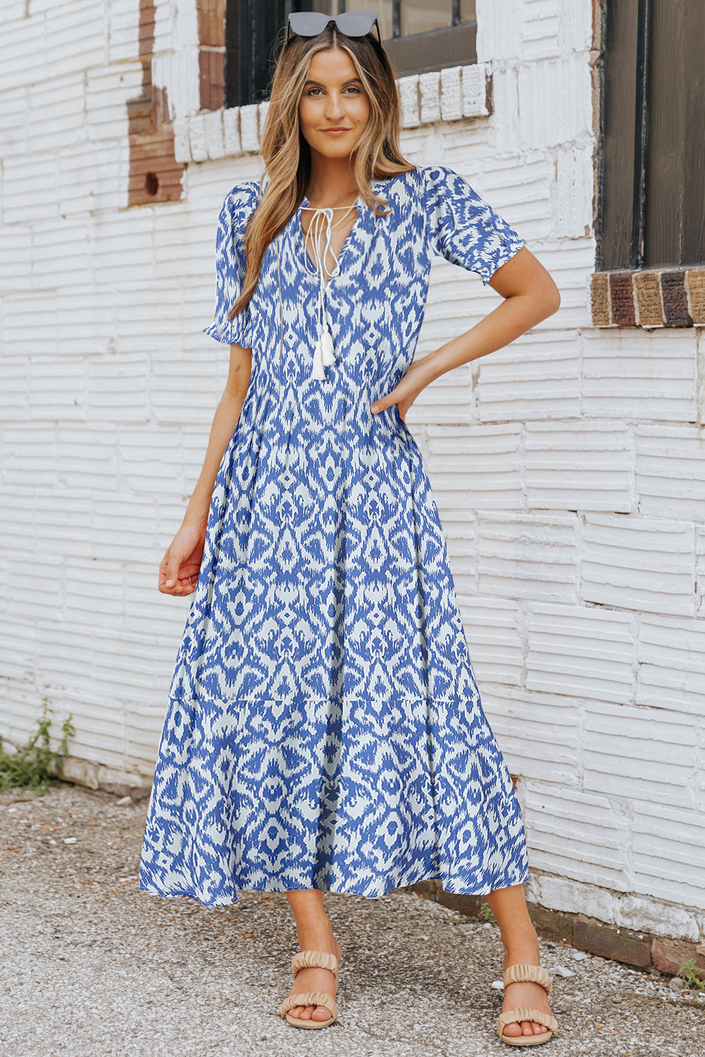 A sky blue V-neck dress with a geometric pattern, perfect for a casual summer maxi-dress look