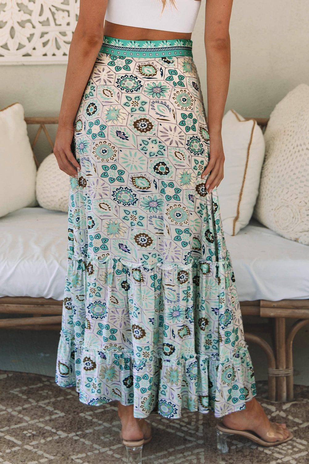 A beautiful sky blue maxi skirt with a feminine floral print and tiered ruffles. Perfect for dressy nights or casual days for an effortlessly stylish look.