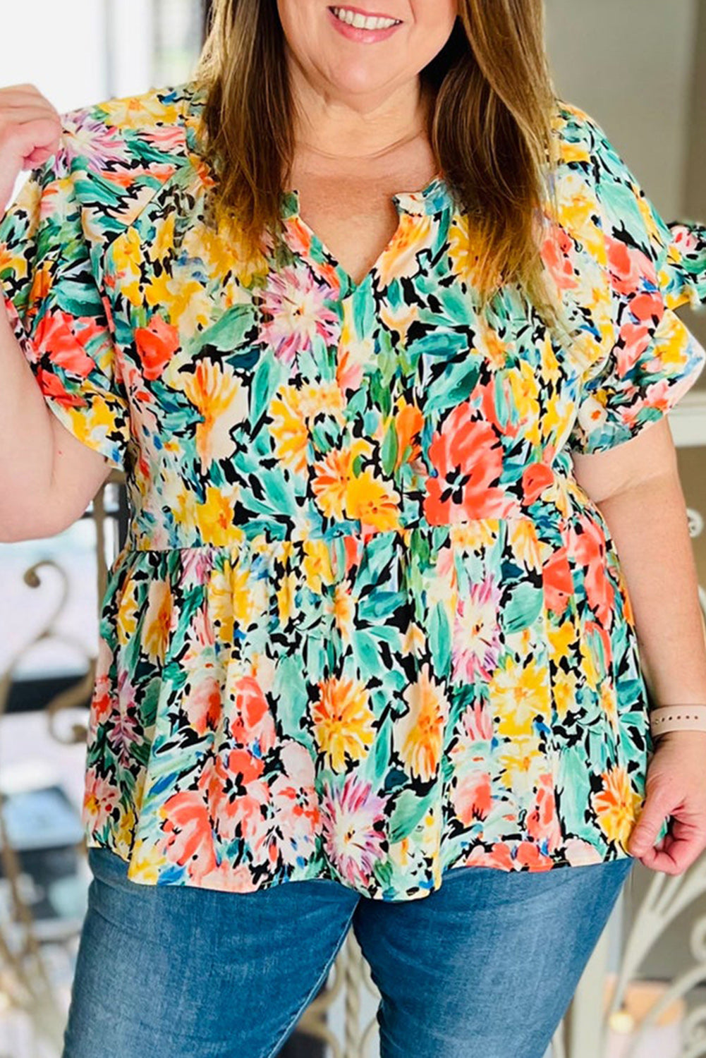 Brighten up your wardrobe with this plus size multicoloured floral ruffled blouse, perfect for warmer days.