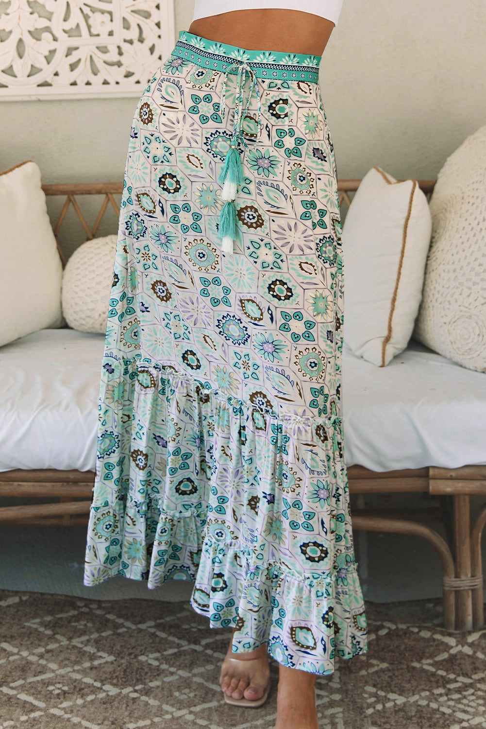 A beautiful sky blue maxi skirt with a feminine floral print and tiered ruffles. Perfect for dressy nights or casual days for an effortlessly stylish look.