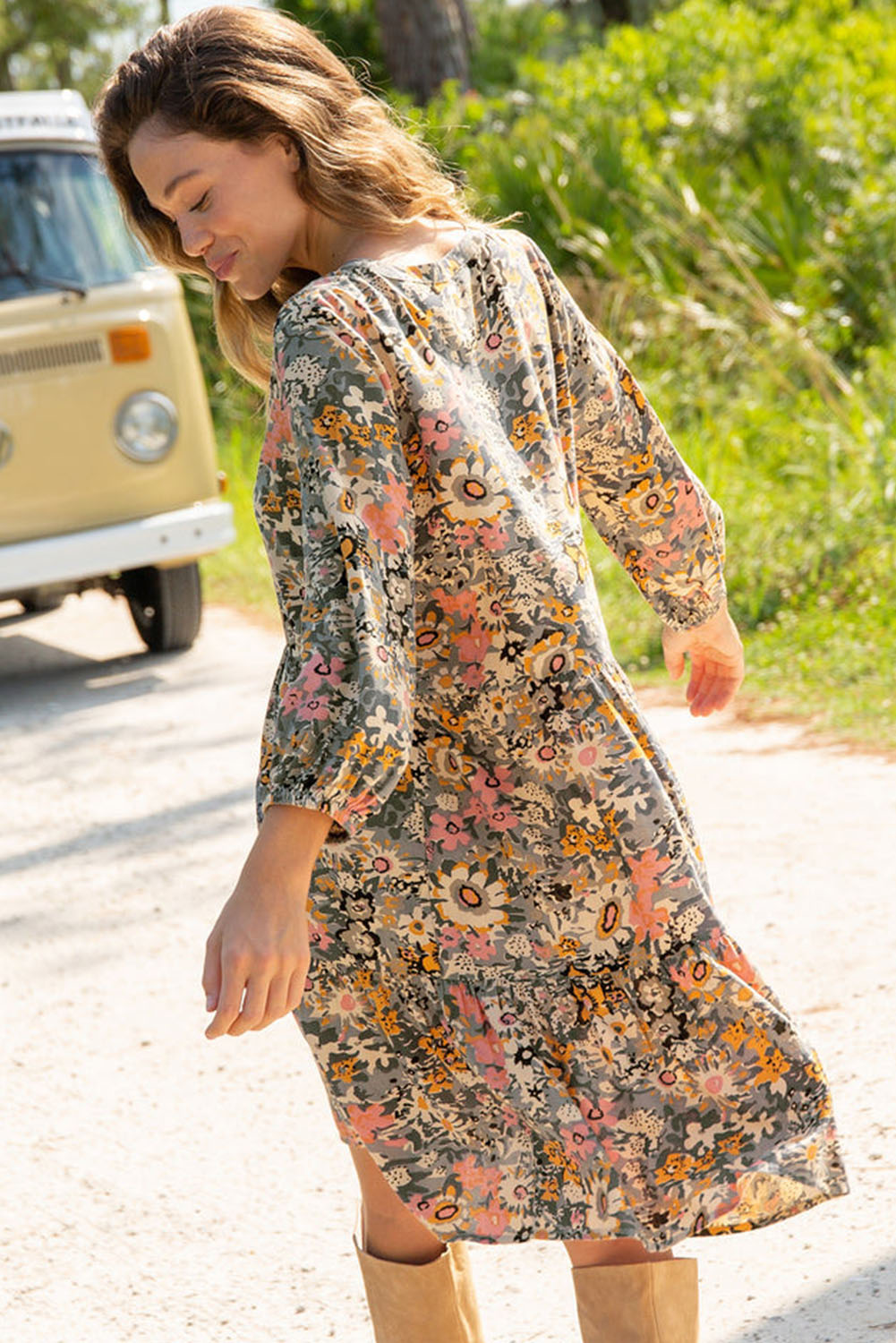 Early autumn collection dress featuring a buttoned crew neck, 3/4 sleeves, and floral pattern on a loose fit viscose fabric.