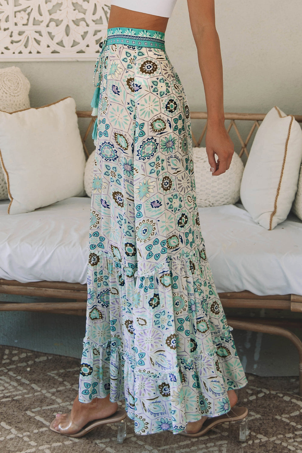 A beautiful sky blue maxi skirt with a feminine floral print and tiered ruffles. Perfect for dressy nights or casual days for an effortlessly stylish look.