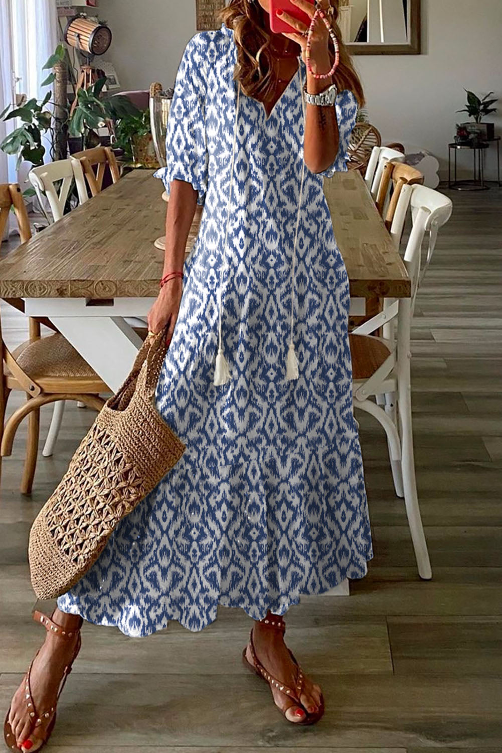 A sky blue V-neck dress with a geometric pattern, perfect for a casual summer maxi-dress look