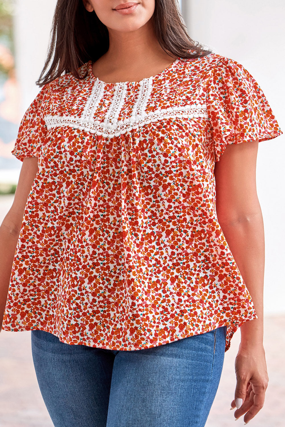 Make a bold statement with this fiery red floral printed blouse featuring lace trim and ruffle sleeves.