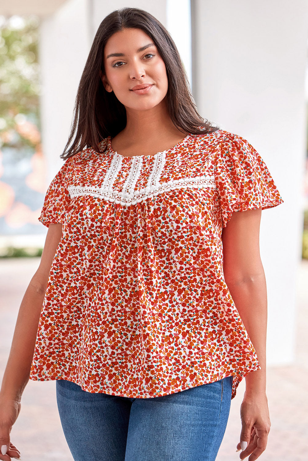 Make a bold statement with this fiery red floral printed blouse featuring lace trim and ruffle sleeves.