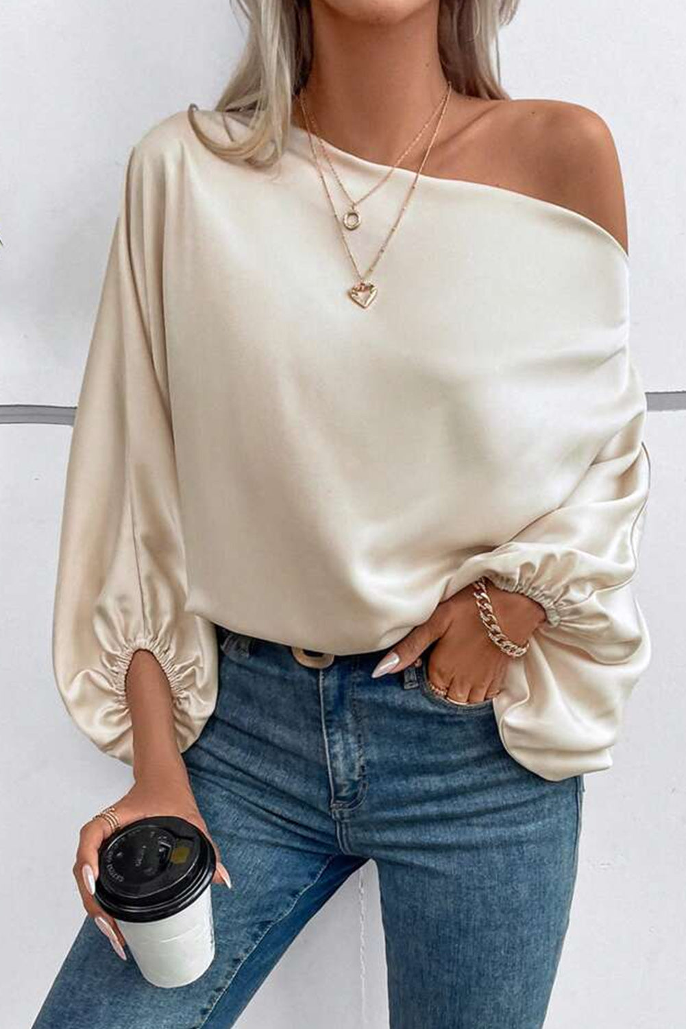 Shiny Asymmetrical Neck Blouse with Balloon Sleeves made of soft and glossy satin fabric.