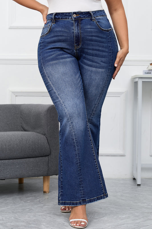 Dark blue plus size bell bottom flare jeans with chic stitching detailing, ideal for casual occasions and designed to flatter all body types for a stylish, vintage look.
