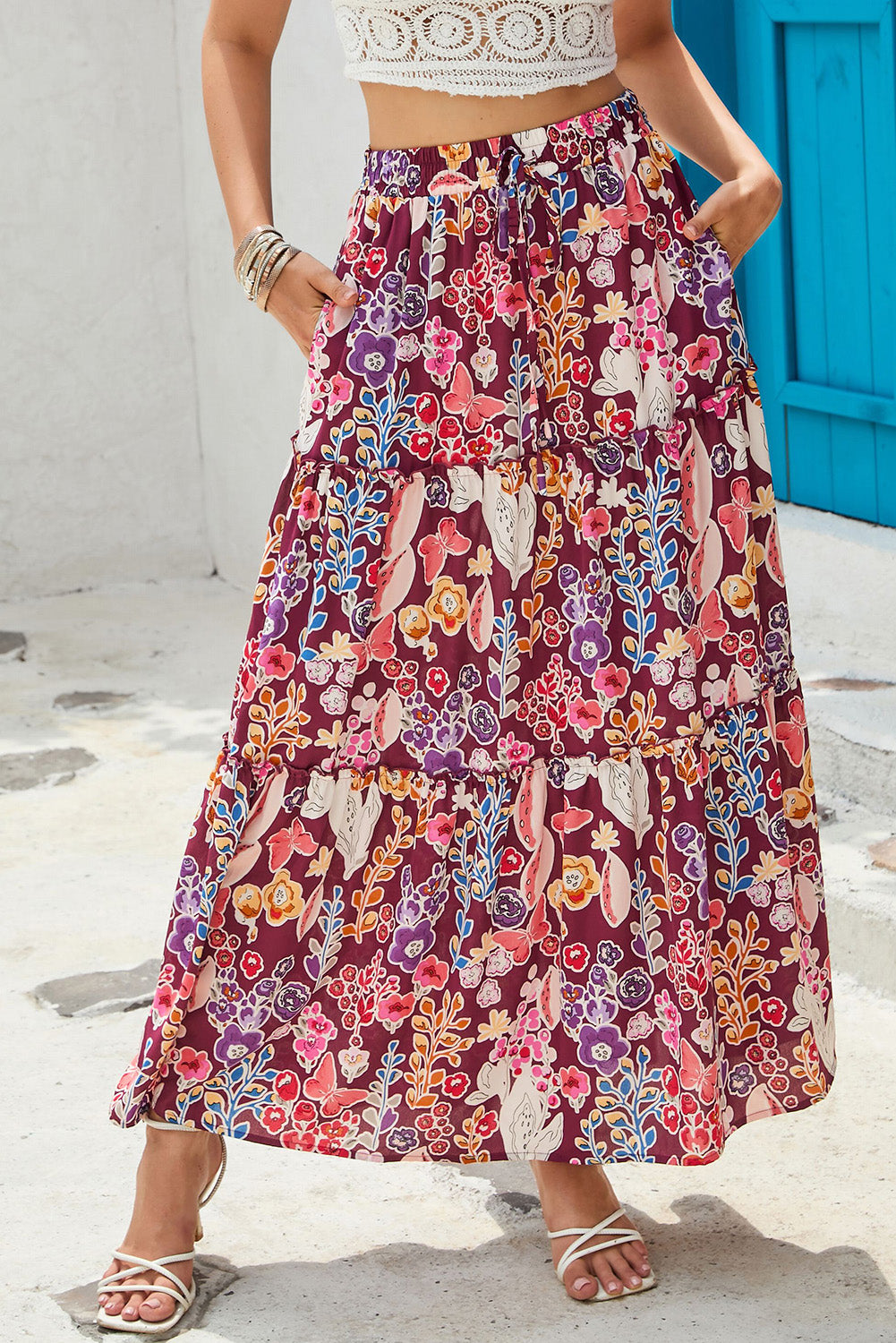 A multicolored boho-style maxi skirt with a bold floral print and a high waist for a flattering shape.