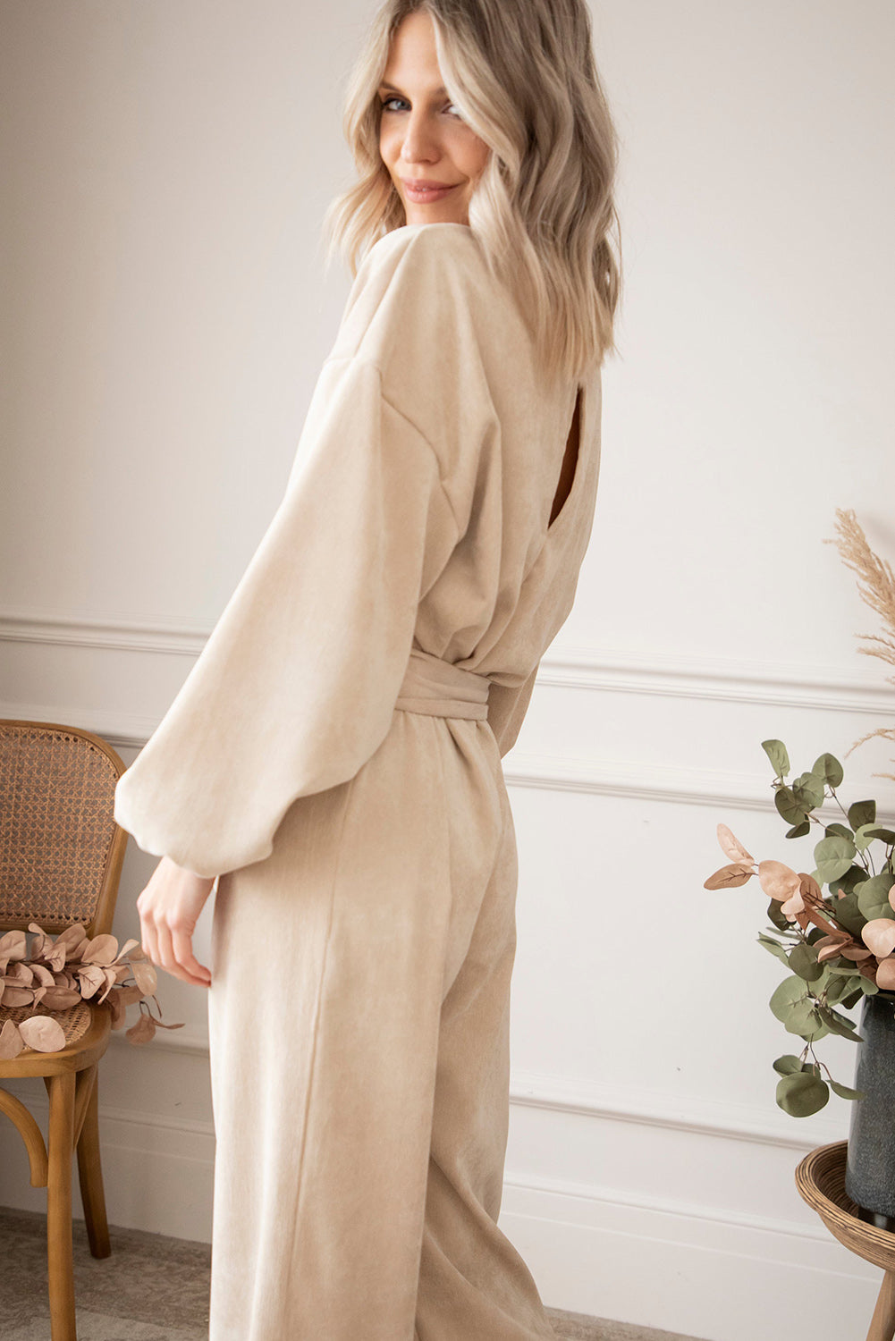   Keyhole Back V Neck Tie Waist Loose Jumpsuit featuring a v-neckline, puff sleeves, a sash tie at the waist, and wide-leg bottoms.